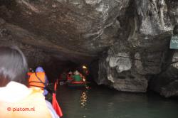 Through a cave.